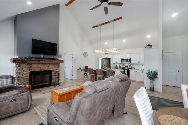 4360 State Highway Ww, Verona, MO 65769 - living area featuring high vaulted ceiling, a ceiling fan, light wood-style floors, and a fireplace