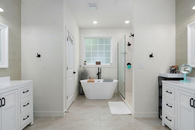 4360 State Highway Ww, Verona, MO 65769 - full bathroom with vanity, a freestanding tub, a stall shower, tile patterned flooring, and recessed lighting