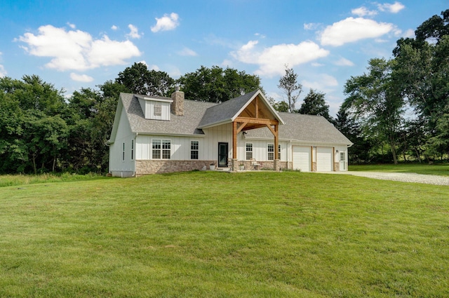 4360 State Highway Ww, Verona, MO 65769 - view of front of home with board and batten siding, driveway, a garage, a chimney, and a front yard