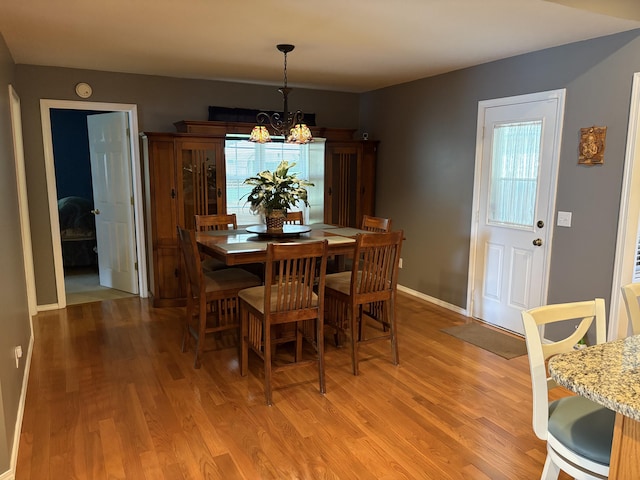4849 W Rose Hill Rd, Billings, MO 65610 - dining space featuring light wood finished floors, a chandelier, and healthy amount of natural light