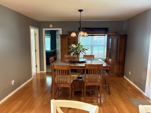 4849 W Rose Hill Rd, Billings, MO 65610 - dining area with light wood-type flooring and a chandelier