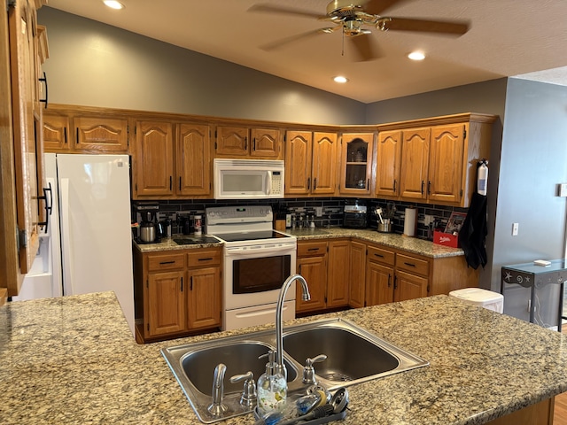 4849 W Rose Hill Rd, Billings, MO 65610 - kitchen featuring white appliances, lofted ceiling, brown cabinetry, a ceiling fan, and backsplash