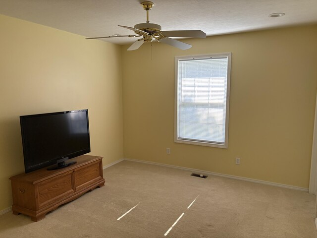 4849 W Rose Hill Rd, Billings, MO 65610 - unfurnished living room with light colored carpet and a ceiling fan