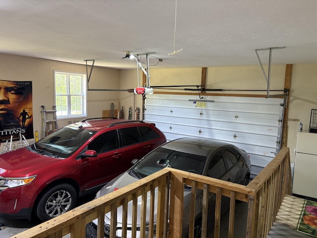 4849 W Rose Hill Rd, Billings, MO 65610 - garage with freestanding refrigerator and a garage door opener