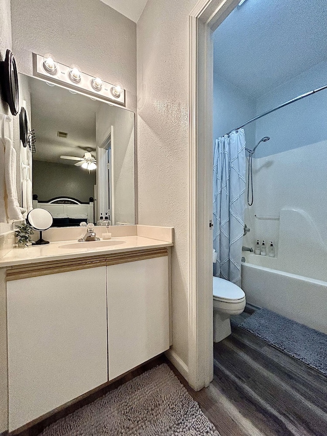 835 Fairview St Unit 3, Branson, MO 65616 - bathroom featuring a ceiling fan, vanity, shower / bathtub combination with curtain, wood finished floors, and a textured wall