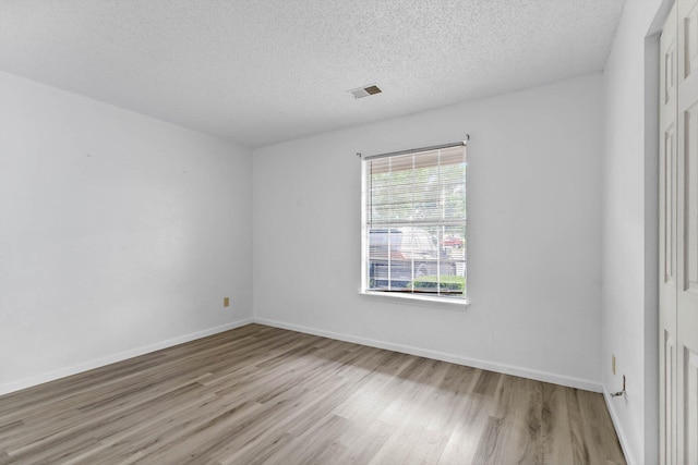 1 Memory Ln Unit 1, Branson, MO 65616 - empty room with wood finished floors and a textured ceiling