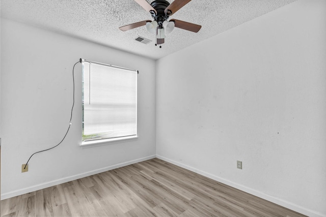 1 Memory Ln Unit 1, Branson, MO 65616 - unfurnished room with a textured ceiling, wood finished floors, and ceiling fan