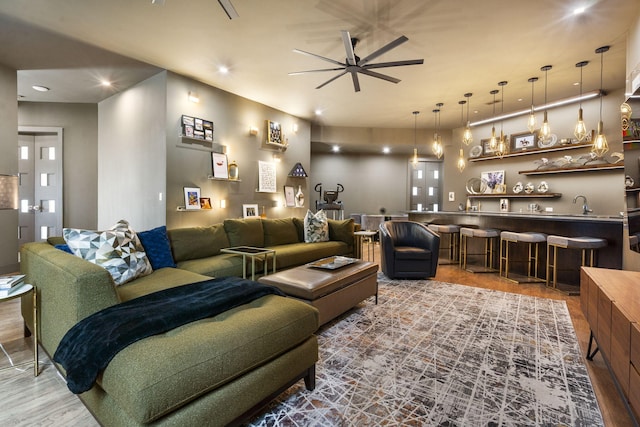 355 Catalina Dr, Branson, MO 65616 - living room featuring ceiling fan, bar with sink, recessed lighting, and wood finished floors