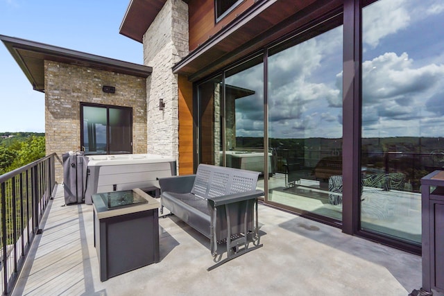 355 Catalina Dr, Branson, MO 65616 - balcony with a hot tub and an outdoor living space with a fire pit