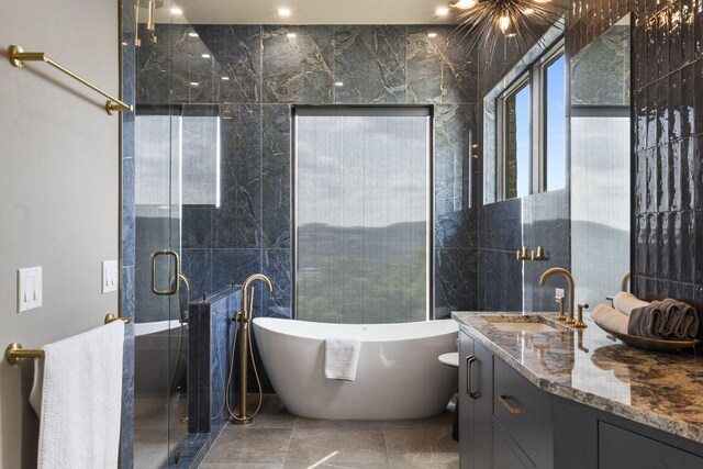 355 Catalina Dr, Branson, MO 65616 - full bath featuring vanity, a soaking tub, a stall shower, and tile walls