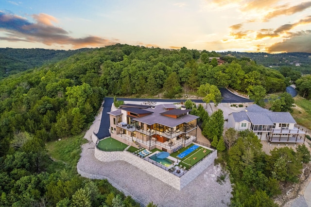 355 Catalina Dr, Branson, MO 65616 - aerial view of property and surrounding area featuring a heavily wooded area