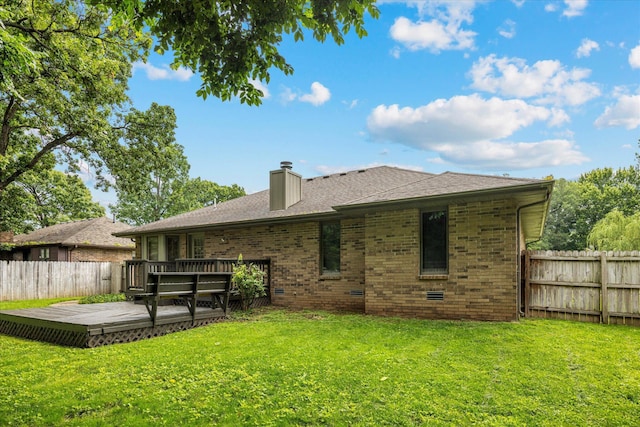 951 S Alex Ave, Springfield, MO 65802 - back of property featuring a wooden deck, a chimney, and brick siding