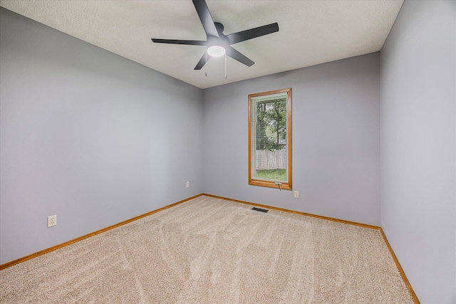 951 S Alex Ave, Springfield, MO 65802 - spare room with carpet, a ceiling fan, and a textured ceiling