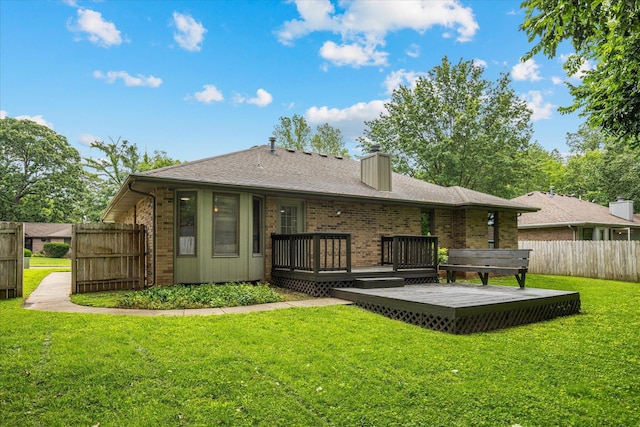 951 S Alex Ave, Springfield, MO 65802 - rear view of house with a deck, brick siding, and a chimney