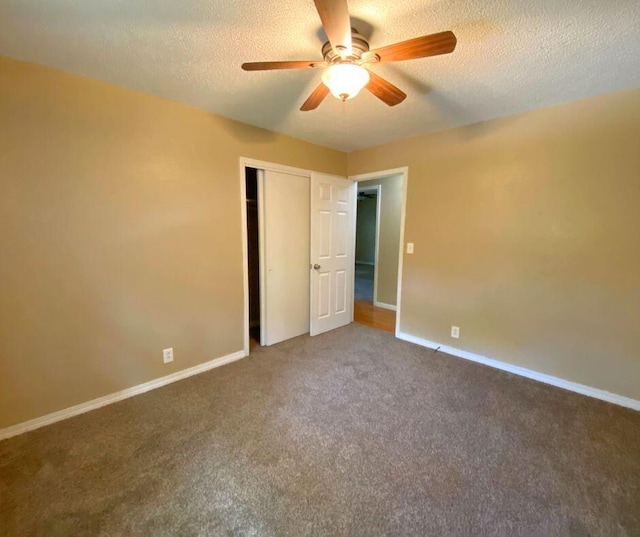 106 Cooley Dr, Carl Junction, MO 64834 - unfurnished bedroom with carpet flooring, a textured ceiling, a closet, and a ceiling fan