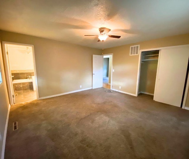 106 Cooley Dr, Carl Junction, MO 64834 - unfurnished bedroom featuring a closet, carpet floors, ensuite bath, and a ceiling fan