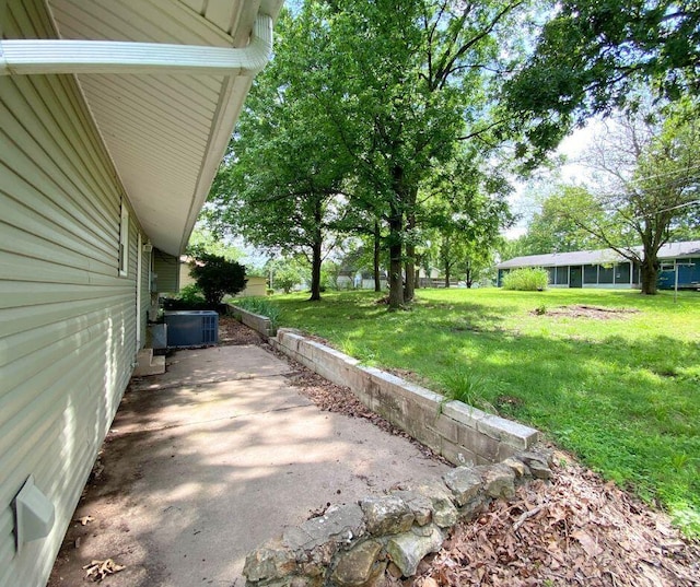 106 Cooley Dr, Carl Junction, MO 64834 - view of green lawn with a patio area
