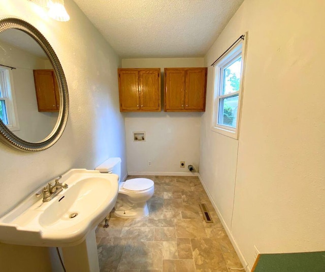 106 Cooley Dr, Carl Junction, MO 64834 - bathroom with a textured ceiling and stone finish flooring