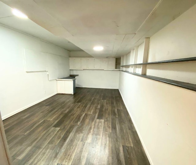 106 Cooley Dr, Carl Junction, MO 64834 - finished basement with dark wood-style flooring and baseboards