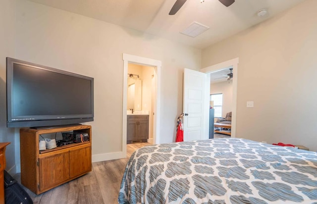 226 W Mount Vernon Rd, Billings, MO 65610 - bedroom featuring wood finished floors, ensuite bath, and ceiling fan