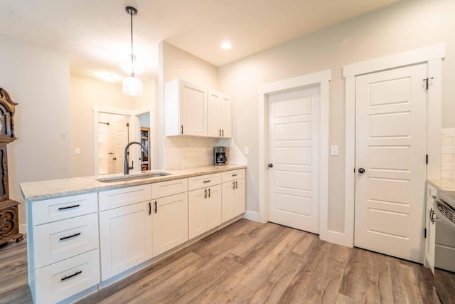 226 W Mount Vernon Rd, Billings, MO 65610 - kitchen with backsplash, white cabinets, light wood finished floors, a peninsula, and recessed lighting