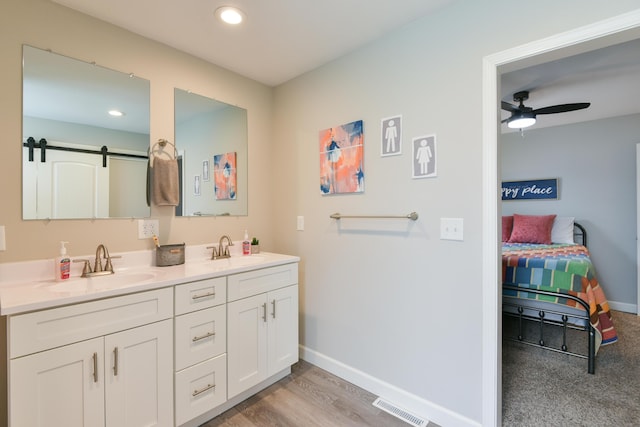 2823 E Catalpa St, Springfield, MO 65804 - ensuite bathroom featuring double vanity, a ceiling fan, recessed lighting, and wood finished floors