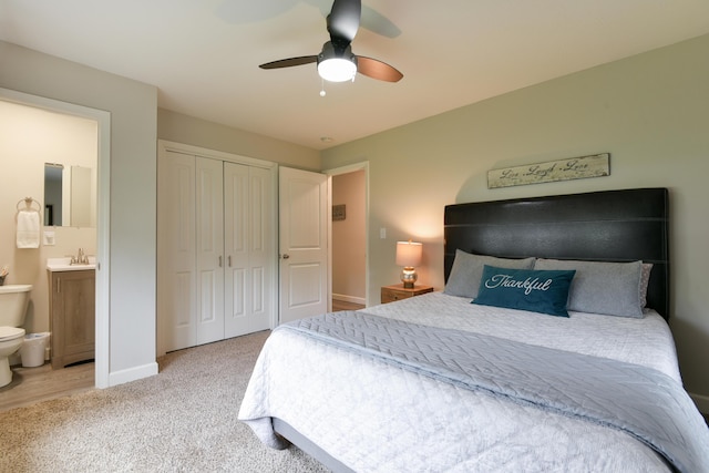 2823 E Catalpa St, Springfield, MO 65804 - carpeted bedroom with a closet, connected bathroom, and a ceiling fan