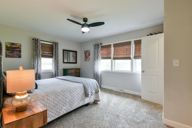 2823 E Catalpa St, Springfield, MO 65804 - carpeted bedroom featuring multiple windows and a ceiling fan