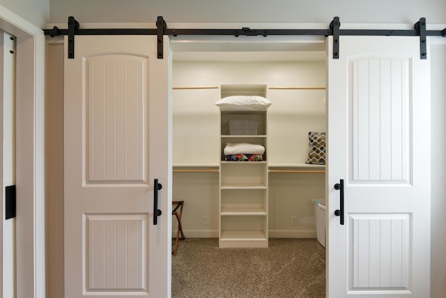 2823 E Catalpa St, Springfield, MO 65804 - spacious closet with a barn door and carpet floors