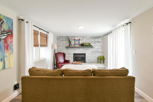 2823 E Catalpa St, Springfield, MO 65804 - living room featuring a fireplace and wood finished floors