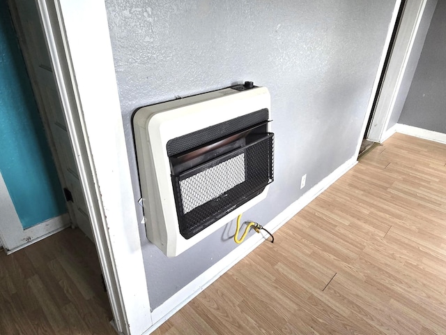 306 S Locust St, Buffalo, MO 65622 - detailed view of heating unit and wood finished floors