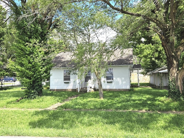 306 S Locust St, Buffalo, MO 65622 - back of house featuring a lawn
