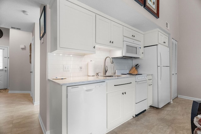 540 Abby Ln Unit 6, Branson, MO 65616 - kitchen featuring white appliances, tasteful backsplash, and white cabinets