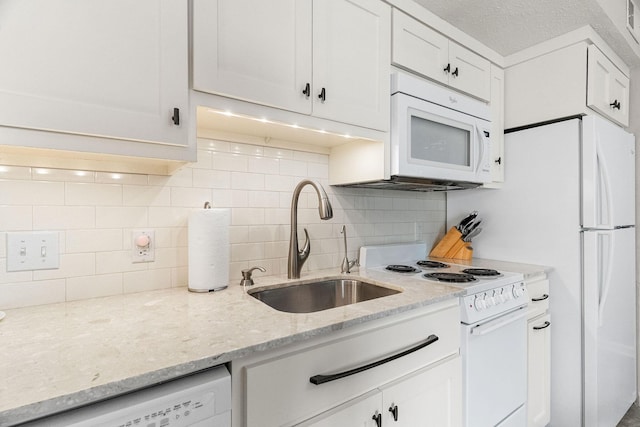 540 Abby Ln Unit 6, Branson, MO 65616 - kitchen with white appliances, white cabinets, decorative backsplash, and light stone countertops