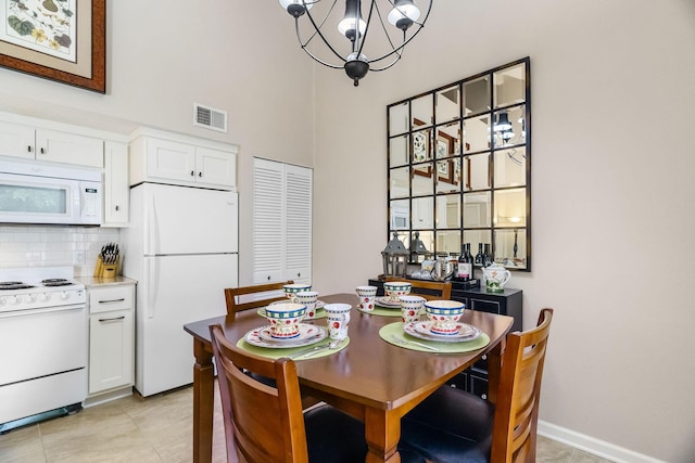 540 Abby Ln Unit 6, Branson, MO 65616 - dining area with a towering ceiling and a chandelier