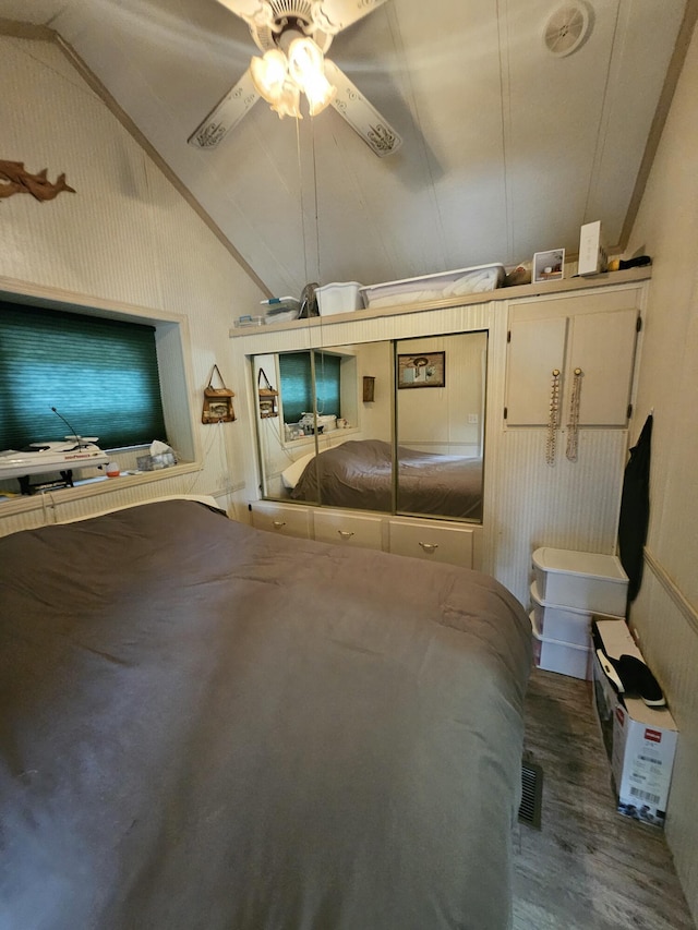 462 Jellystone Ave, Hollister, MO 65672 - unfurnished bedroom featuring vaulted ceiling and wood finished floors