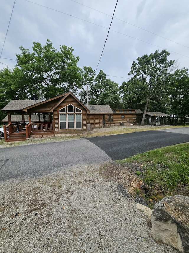 462 Jellystone Ave, Hollister, MO 65672 - view of front facade featuring log veneer siding