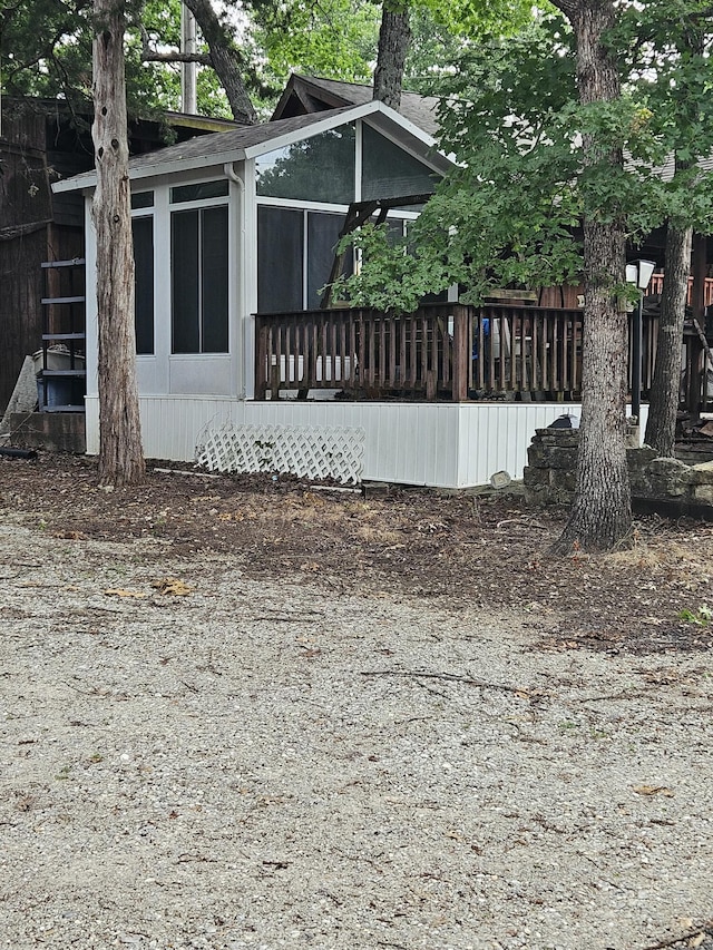 462 Jellystone Ave, Hollister, MO 65672 - view of side of home with a sunroom