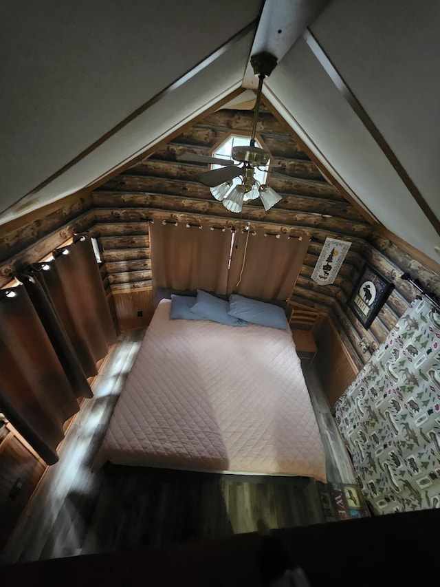 462 Jellystone Ave, Hollister, MO 65672 - unfurnished bedroom featuring wood finished floors, log walls, and lofted ceiling