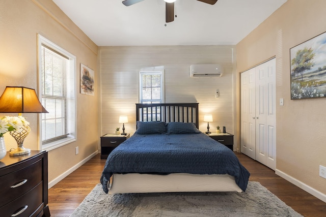 19899 E 1820th Rd, Fair Play, MO 65649 - bedroom with an AC wall unit, a closet, wood finished floors, and ceiling fan