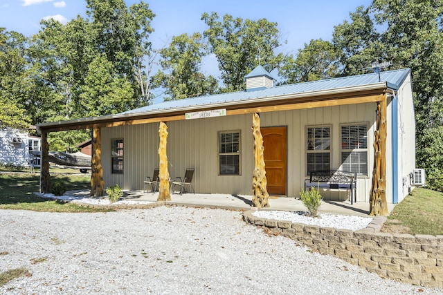 19899 E 1820th Rd, Fair Play, MO 65649 - view of front of home featuring a metal roof and a porch