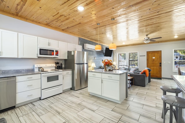 19899 E 1820th Rd, Fair Play, MO 65649 - kitchen featuring appliances with stainless steel finishes, wooden ceiling, healthy amount of natural light, open floor plan, and white cabinetry