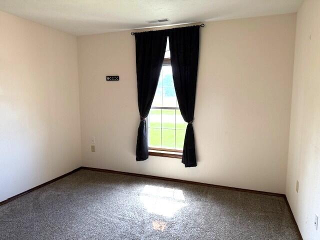 2604 Country Dr, Mountain Grove, MO 65711 - carpeted empty room with baseboards