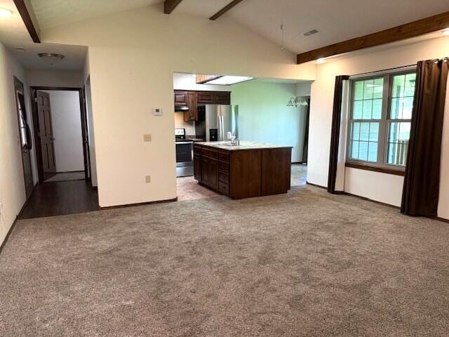 2604 Country Dr, Mountain Grove, MO 65711 - kitchen with appliances with stainless steel finishes, dark brown cabinetry, light countertops, carpet floors, and a center island with sink