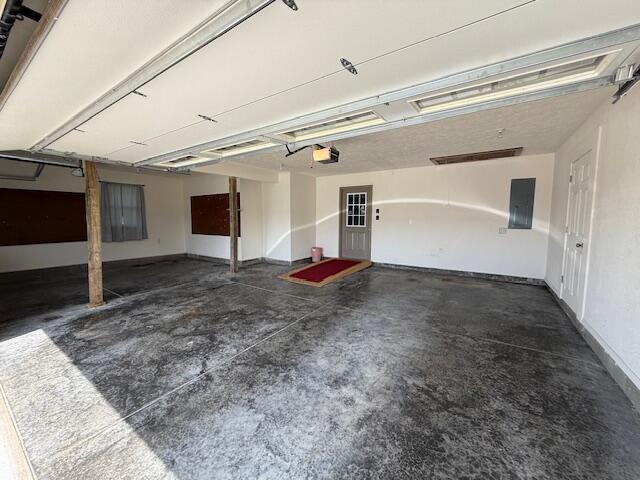 2604 Country Dr, Mountain Grove, MO 65711 - garage with a garage door opener and electric panel