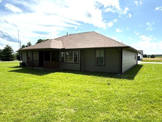 2604 Country Dr, Mountain Grove, MO 65711 - back of property featuring a yard and a shingled roof