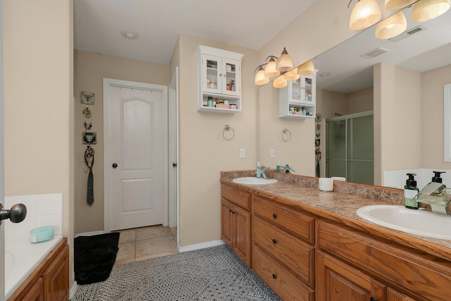 3223 W Melbourne St, Springfield, MO 65810 - full bath with a shower stall, double vanity, tile patterned floors, and a tub