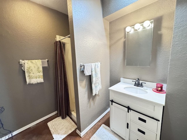 3517 Hackberry Ln, Joplin, MO 64801 - full bathroom with vanity, a textured wall, and a stall shower