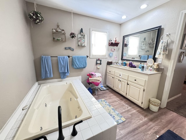 3517 Hackberry Ln, Joplin, MO 64801 - full bath with vanity, a whirlpool tub, wood finished floors, and recessed lighting