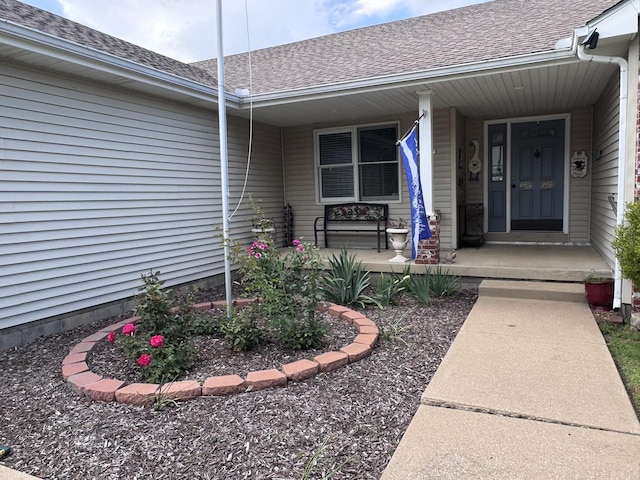 3517 Hackberry Ln, Joplin, MO 64801 - property entrance with a shingled roof and covered porch